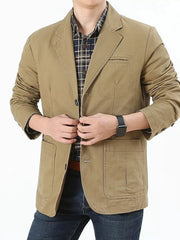 Khaki cotton button-up blazer with patch pockets and a plaid shirt.