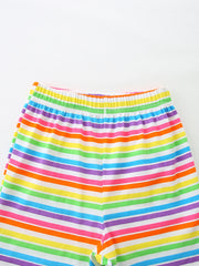 Baby girls' rainbow striped cotton shorts with elastic waistband.