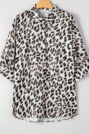 Leopard print oversized button-down blouse with 3/4 sleeves.