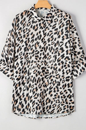 Leopard print oversized button-down blouse with 3/4 sleeves.