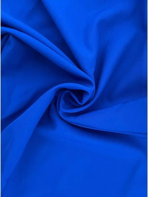 Royal blue two-piece set with layered ruffles and crop top.