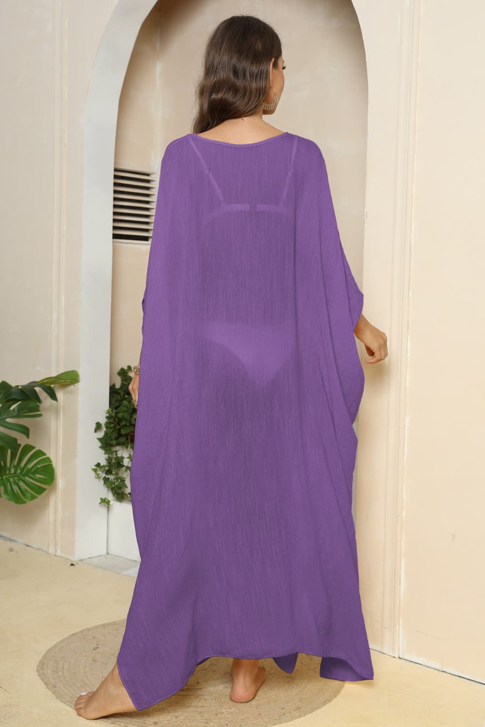 Purple oversized caftan cover-up with side slits, sheer fabric, v-neck, long flowy sleeves.