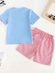 Baby blue t-shirt and pink gingham shorts set with playful chicken appliqué detail.