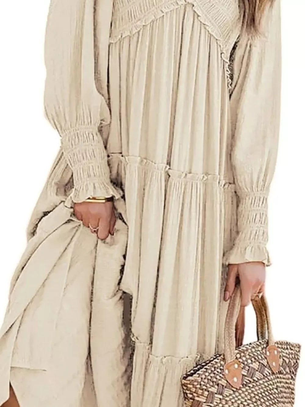 Apricot smocked v-neck tiered maxi dress with ruffled details and smocked cuffs.