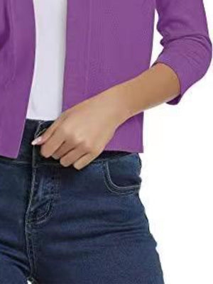 Cropped elbow-sleeve open-front knit cardigan in Dusty Purple, styled with jeans.