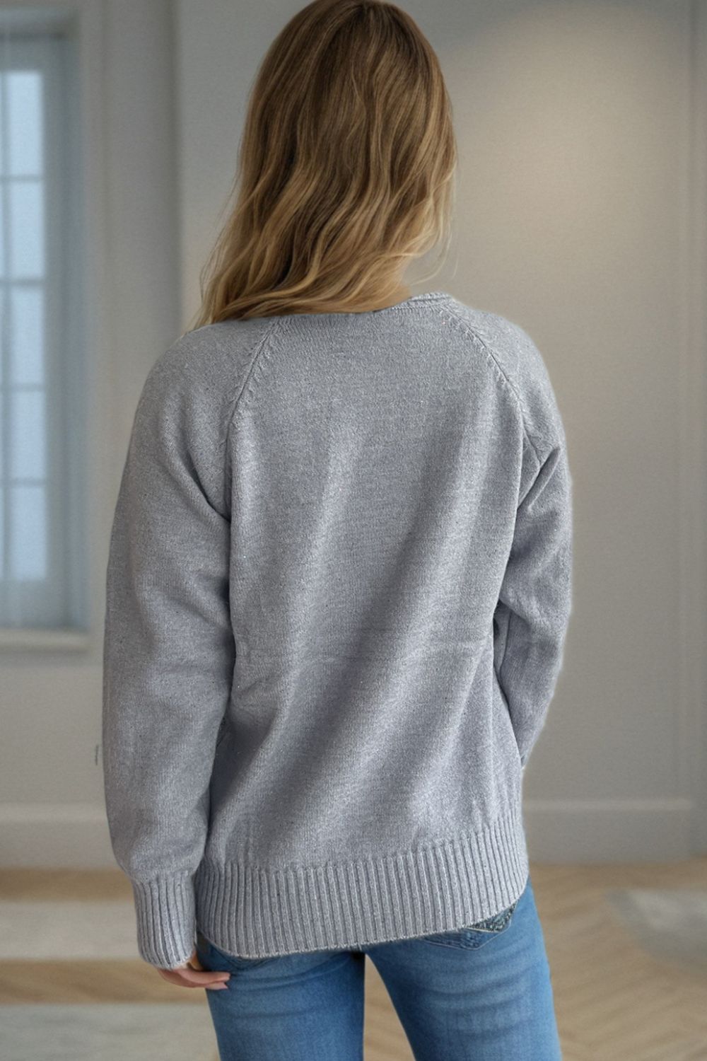 Gray speckled Donegal turtleneck pullover sweater with ribbed cuffs and hem.