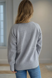 Gray speckled Donegal turtleneck pullover sweater with ribbed cuffs and hem.