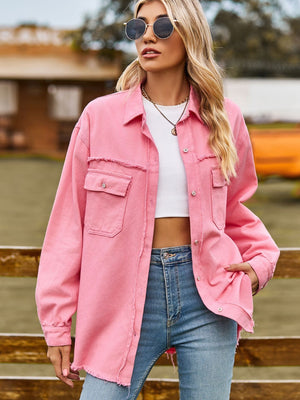 Pink frayed edge overshirt with patch pockets and button front, styled with a white crop top and jeans.