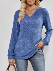 Cobalt blue textured ribbed V-neck pullover sweater with long sleeves.