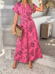 Hot Pink geometric print wide-leg jumpsuit with short sleeves and V-neck.