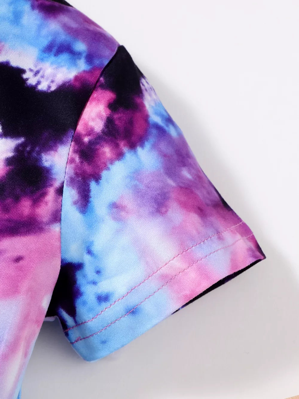 Toddler girls' tie-dye t-shirt with pink and blue swirls.
