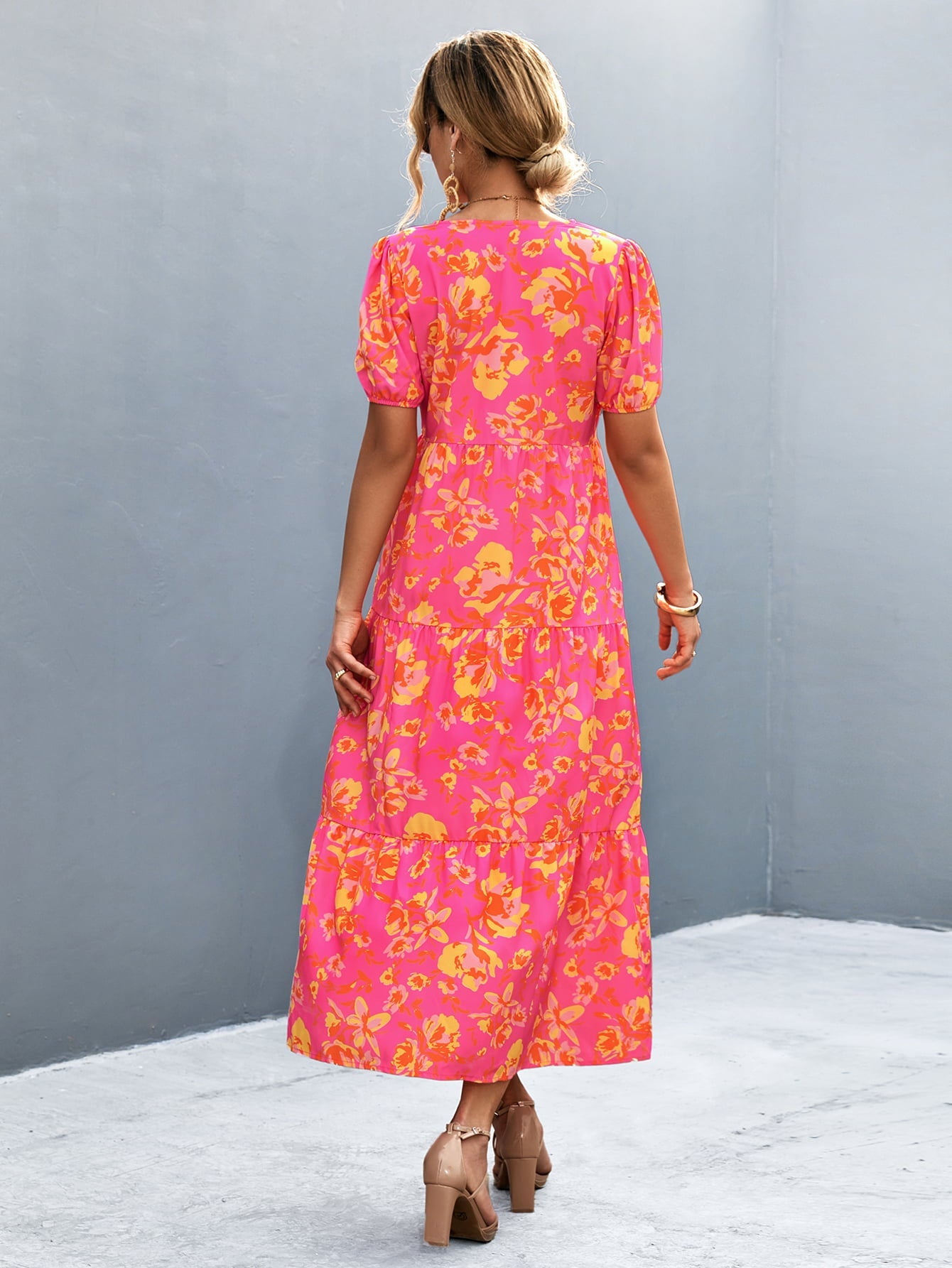 Floral print midi dress in hot pink with puff sleeves and tiered skirt.