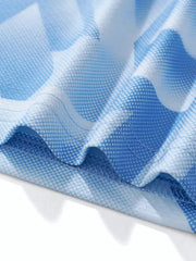 Toddler boys' breathable blue geometric print tee and shorts set fabric detail.