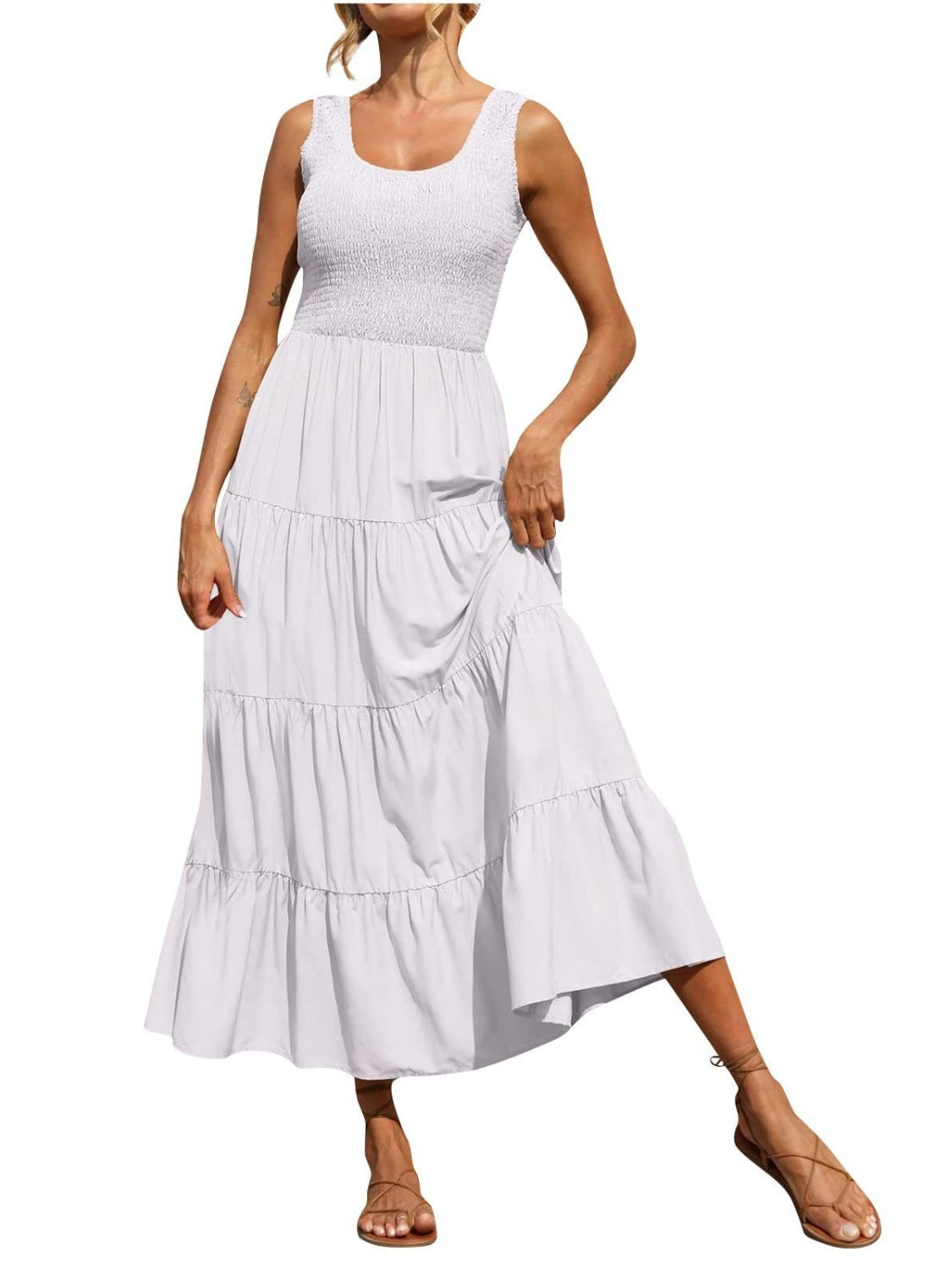White smocked bodice ruffled maxi dress with tiered skirt and square neckline.