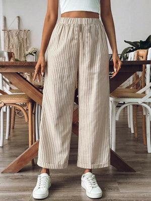 Chic high-waisted striped wide-leg pants in beige and white, featuring an elastic waistband and cropped length.