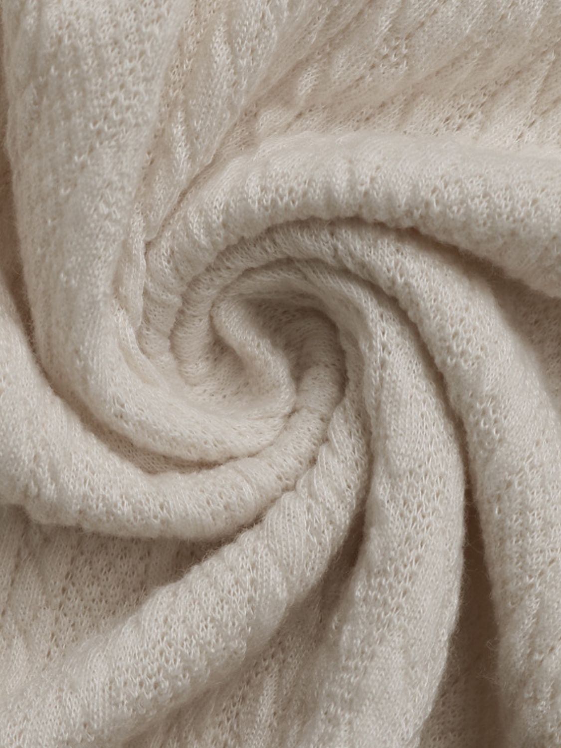 Cream textured knit henley top with subtle diamond pattern detail