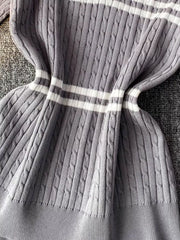 Grey cable knit t-shirt with white stripes and a polo collar.