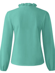 Teal blouse with ruffled neckline and balloon sleeves.
