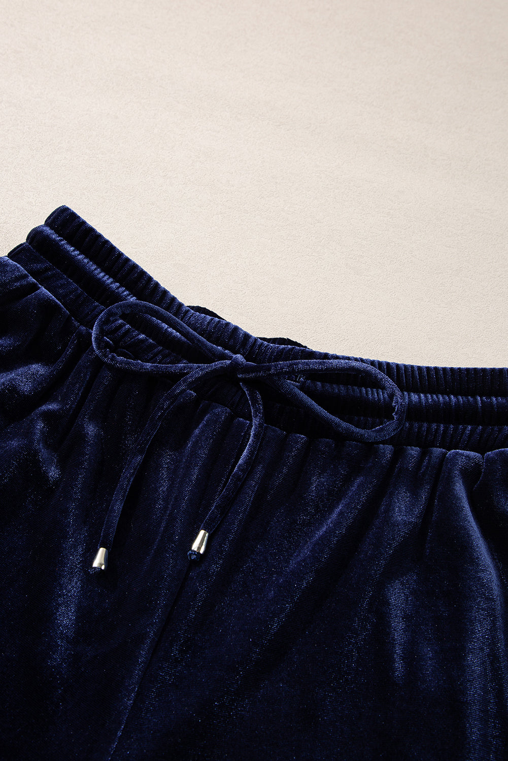 Indigo velvet culotte set with drawstring waist and silver-tipped ties.