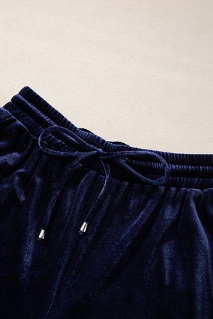 Indigo velvet culotte set with drawstring waist and silver-tipped ties.