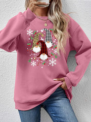 Blush Pink raglan sweatshirt with festive gnome graphic, snowflakes and candy canes.