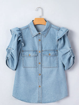 Light wash denim button-down shirt with ruffled short sleeves and ruched cuffs.