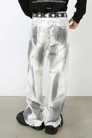 Brushstroke denim jeans in light with a wide leg and raw hem.
