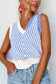 Chevron knit vest in light blue and white with a V-neck and ribbed hem.
