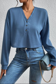 Dusty blue waffle knit crop top with henley neckline and button detail
