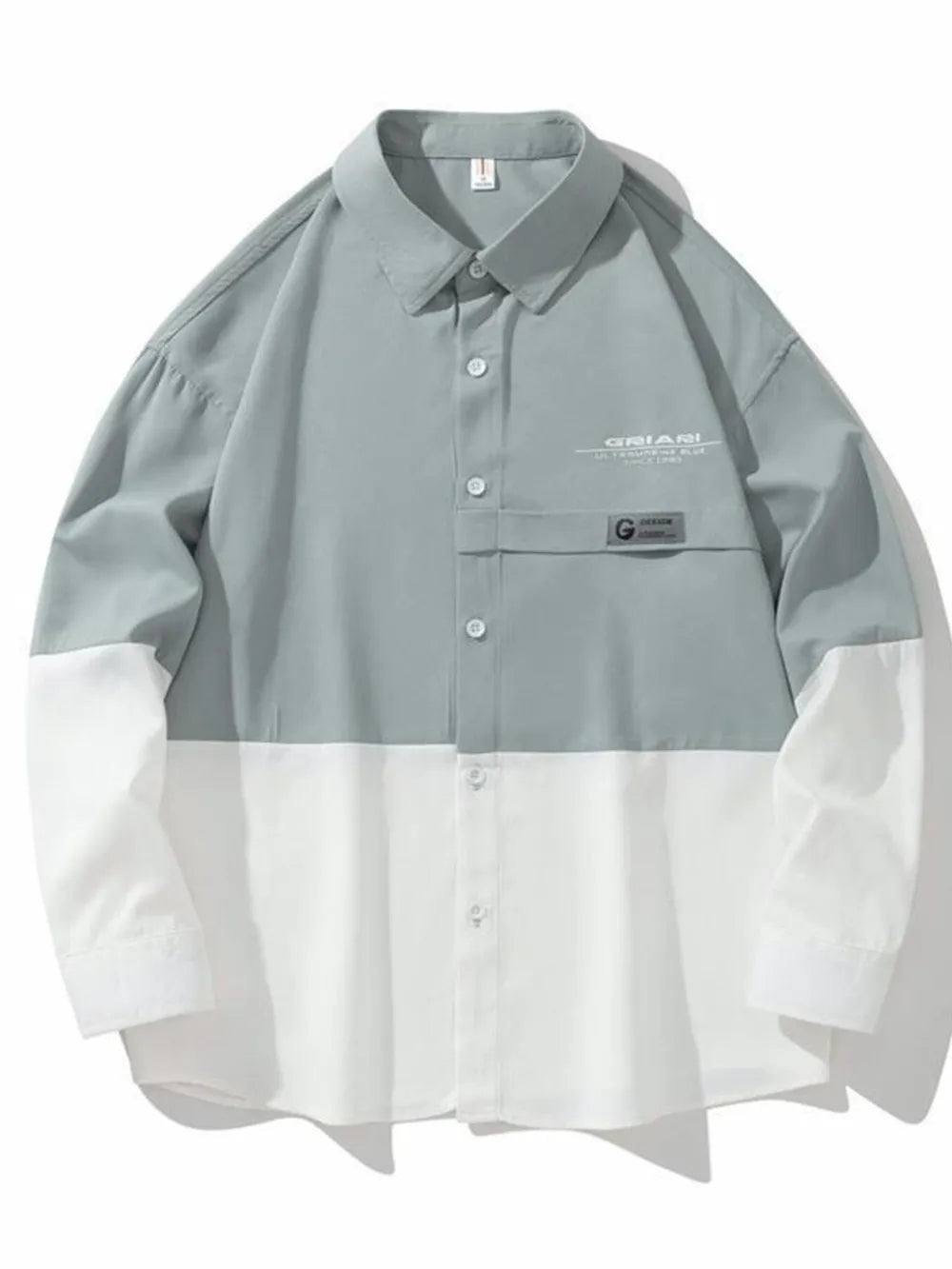 Two-tone oversized casual button-down shirt in French Blue and white color-block with chest pocket detail.