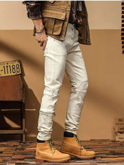Men's cream cotton denim jeans with zip ankle detail and tailored slim fit.
