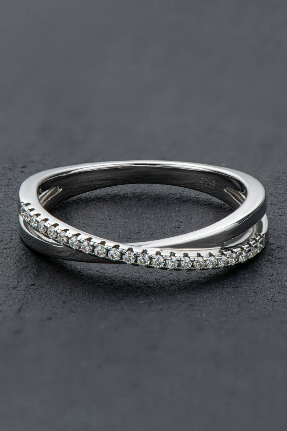 Silver crossover band ring with pavé moissanite stones on sterling silver.