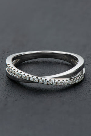 Silver crossover band ring with pavé moissanite stones on sterling silver.