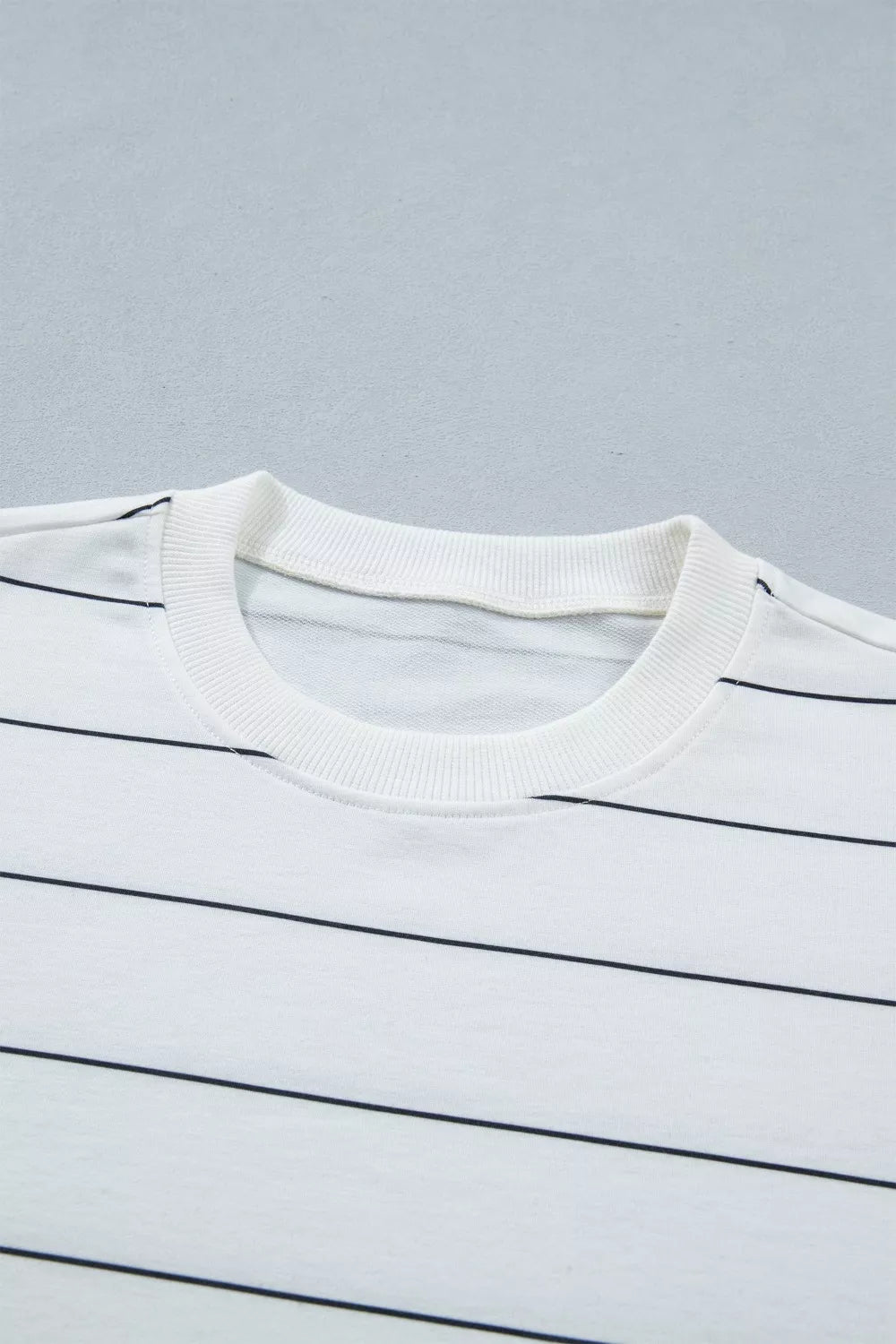 White striped polyester tee with crew neck.