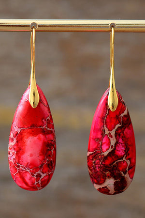 Ocean Jasper dangle earrings in red with gold accents and a unique marbled pattern.