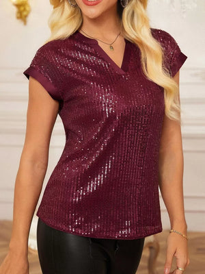 Burgundy sequin cap sleeve blouse with V-neck and satin trim.