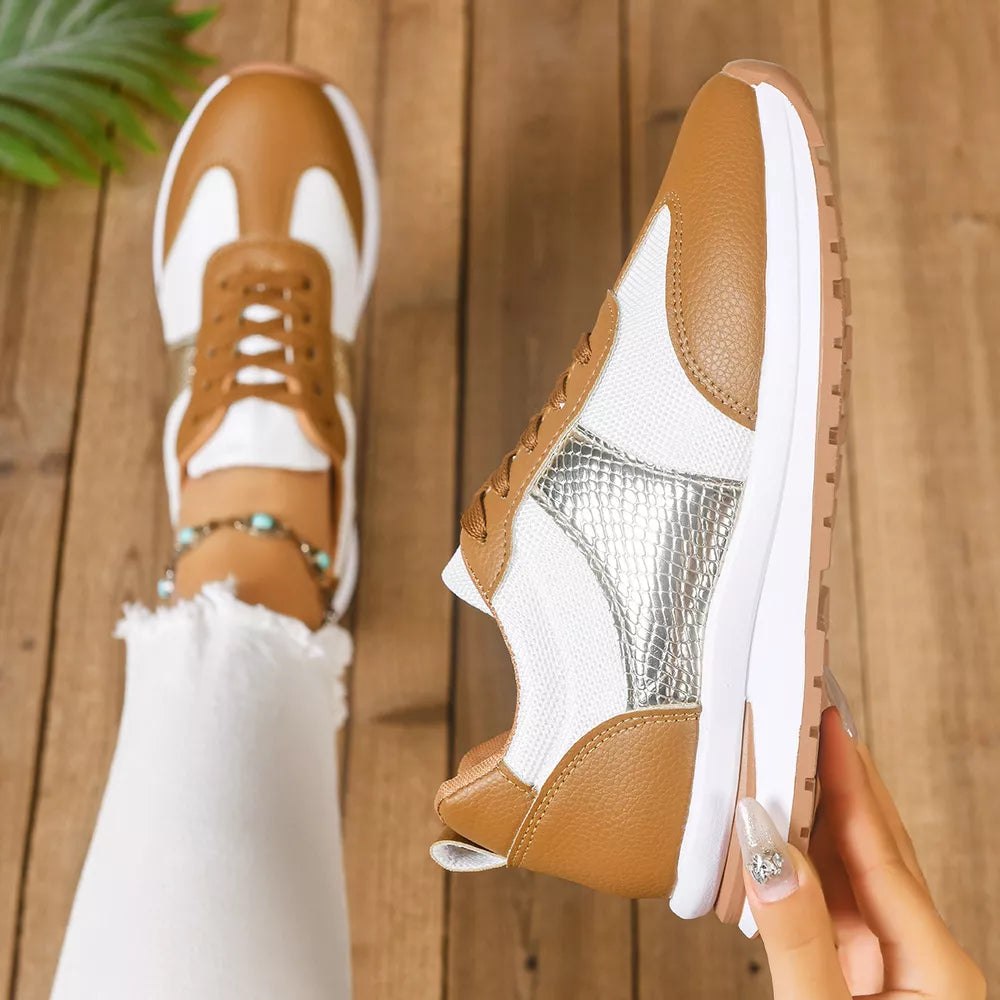Chic lace-up sneakers in light brown and white with textured silver accents.