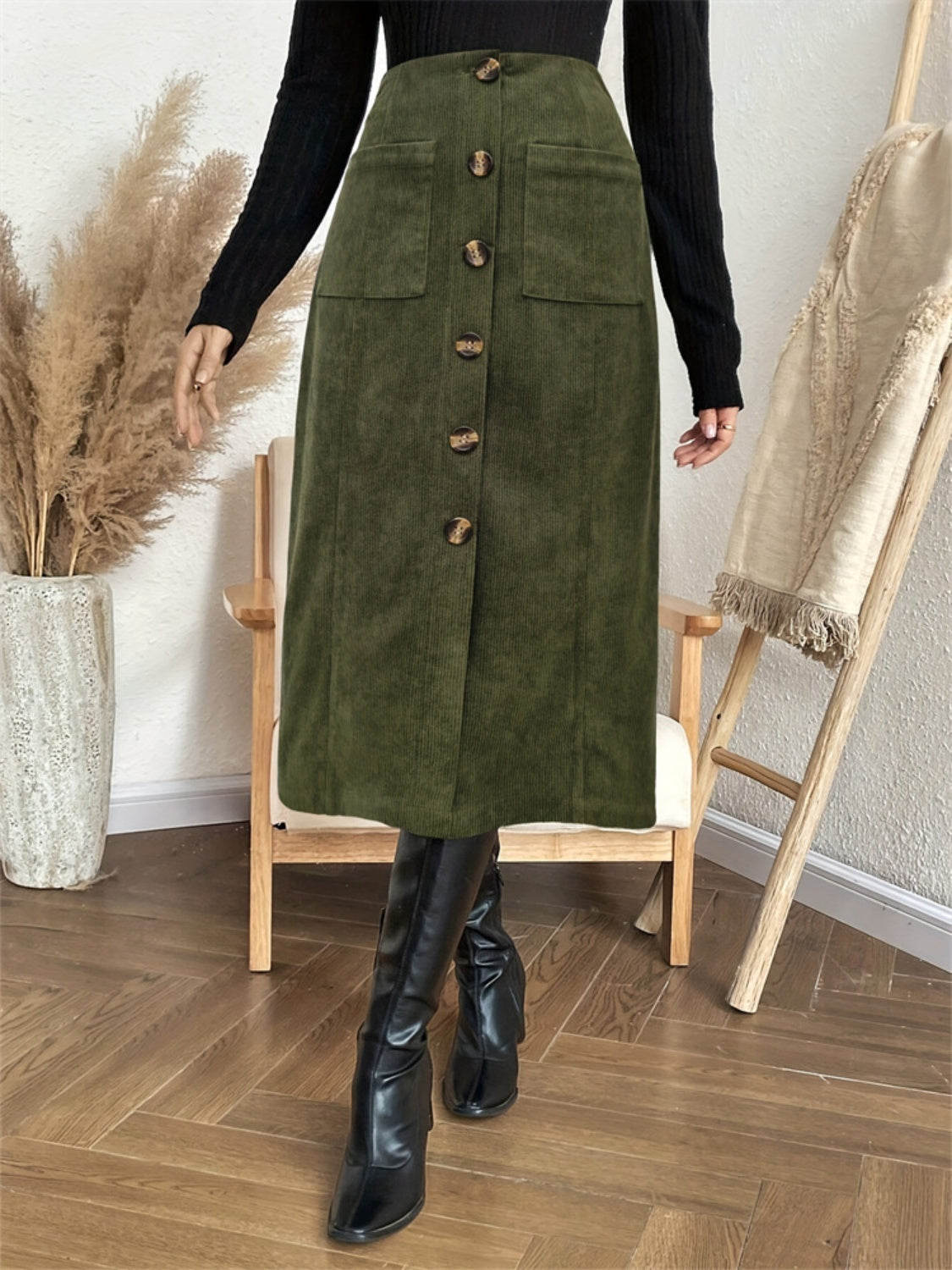 Army green corduroy button-down A-line midi skirt with front pockets and wooden buttons.