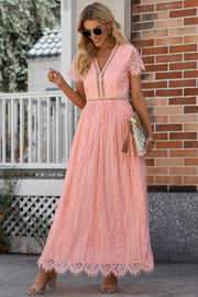 Peach lace midi dress with V-neck, short sleeves, and scalloped hem.