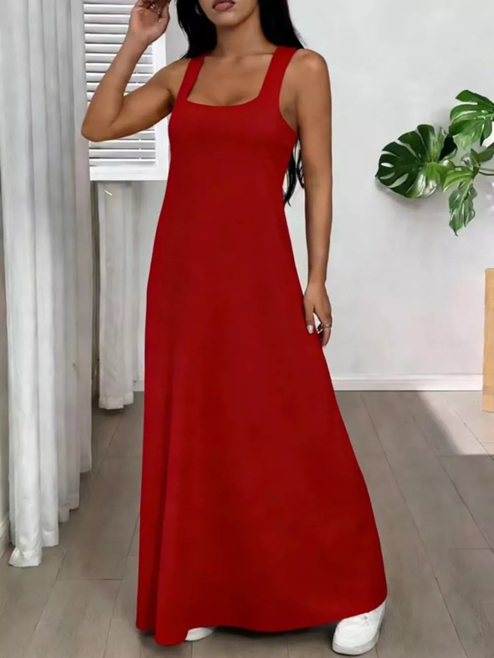 Red scoop neck cami maxi dress with a flowing skirt.