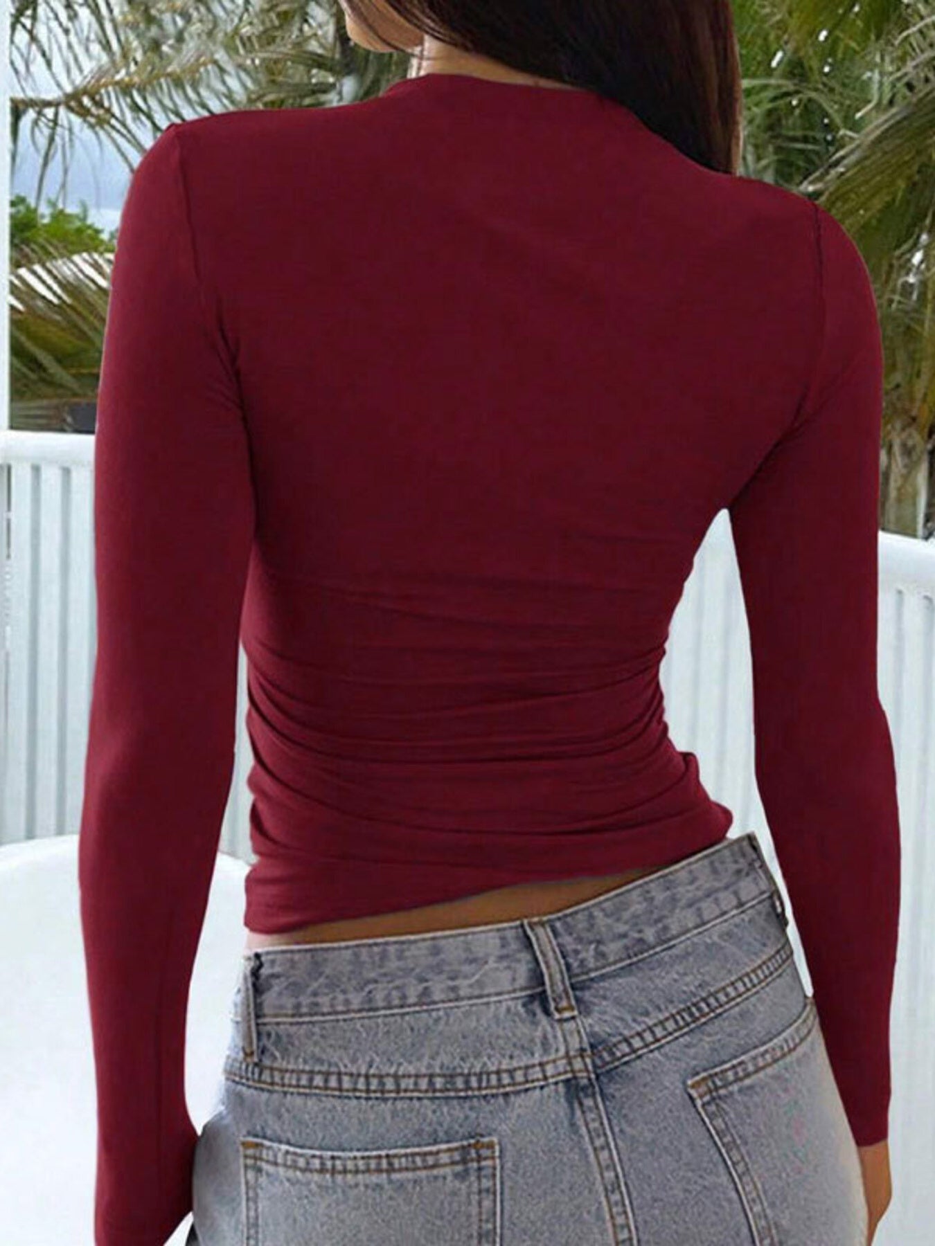 Red long sleeve slim fit t-shirt with ruched side detail.