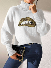 White turtleneck sweater with sequin leopard lip graphic and balloon sleeves.