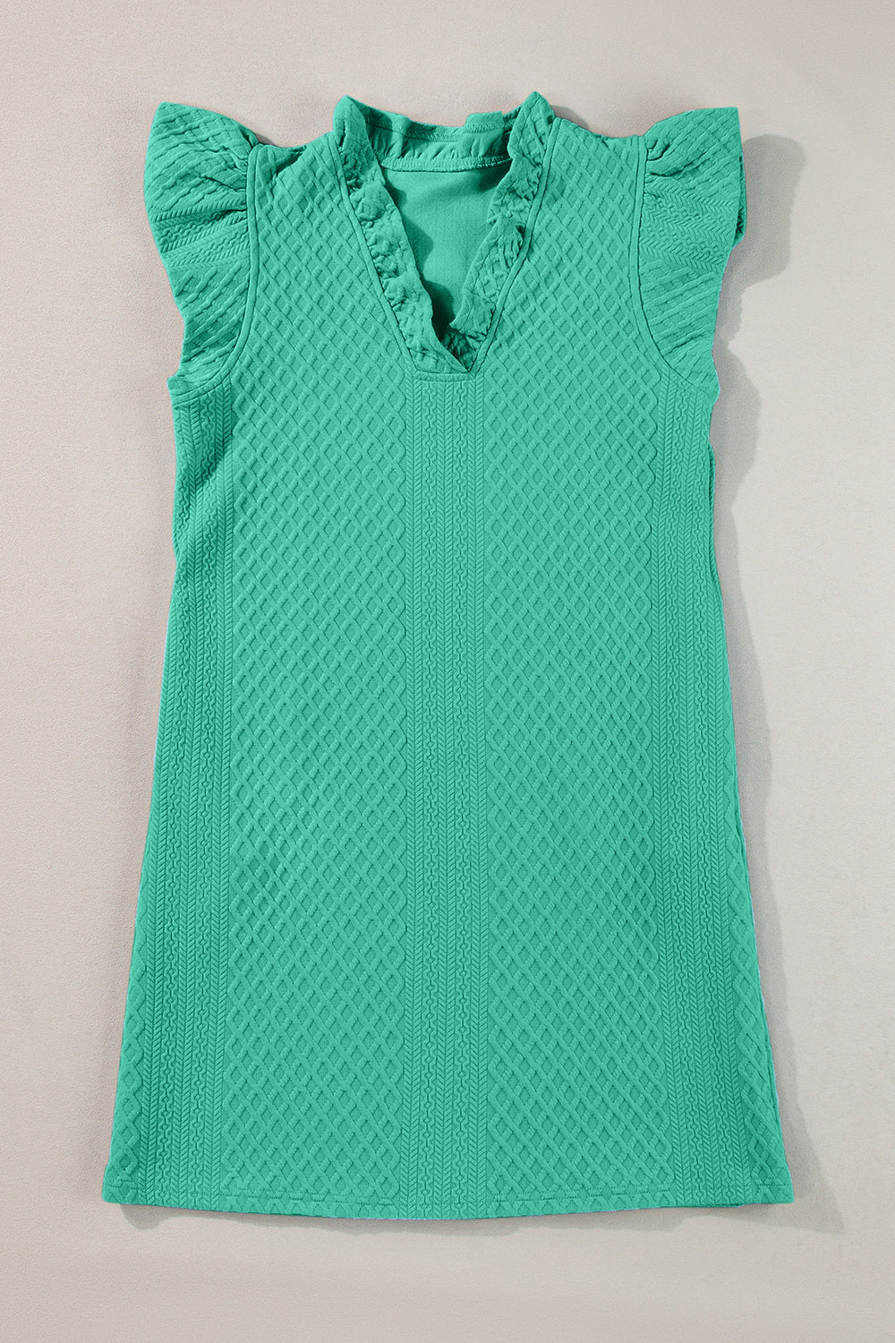 Textured turquoise trapeze dress with ruffle sleeves and v-neckline.