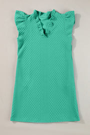 Textured turquoise trapeze dress with ruffle sleeves and v-neckline.