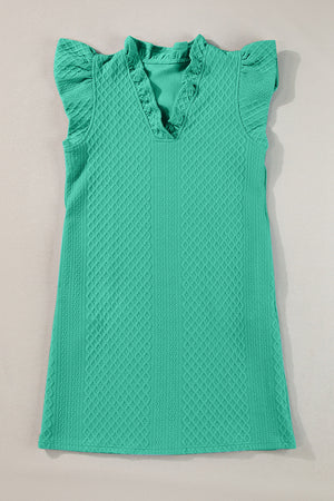 Textured turquoise trapeze dress with ruffle sleeves and v-neckline.