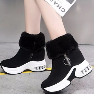 Black plush ankle boots with side zipper and air cushion wedge sole.