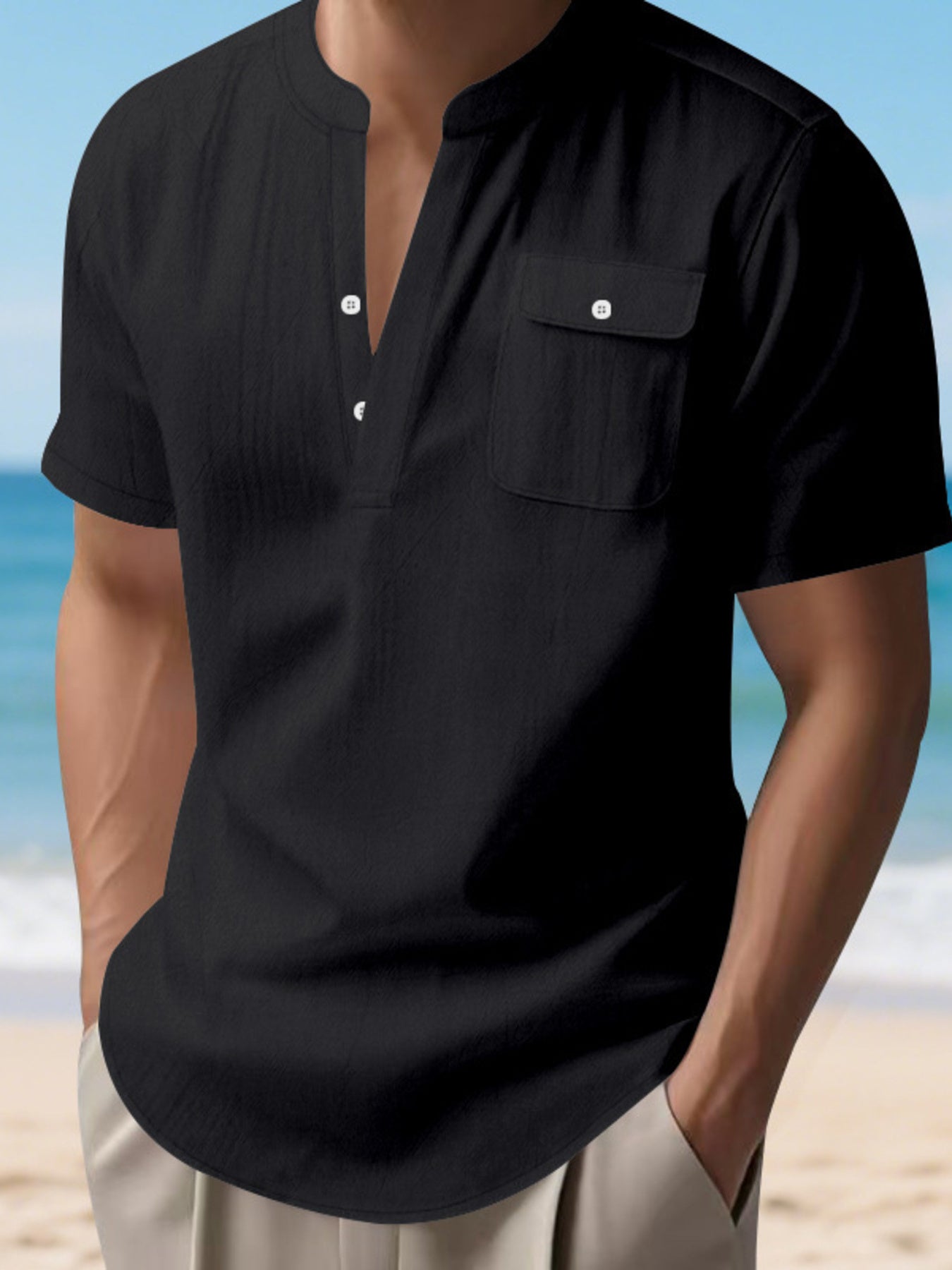 Black short sleeve henley shirt with band collar, button placket, and chest pocket.