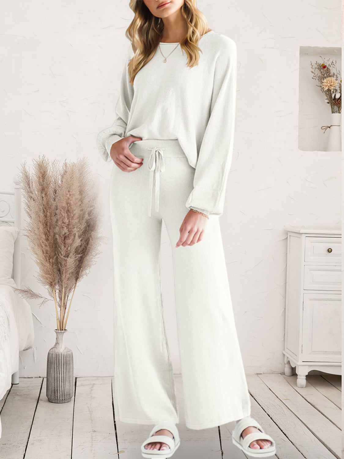Ivory wide-leg knit loungewear set with drawstring waist and long sleeves.