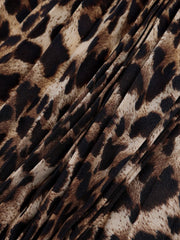 Leopard print maxi skirt with knife pleats and a draped detail.