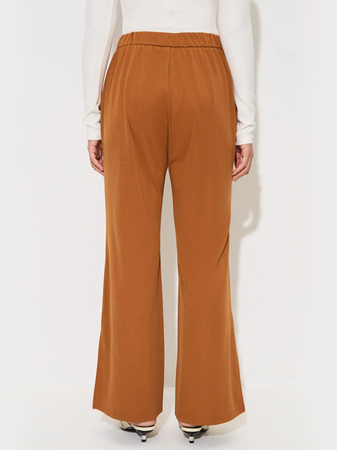 Seamed flare-leg trousers in sherbet with an elastic waistband.